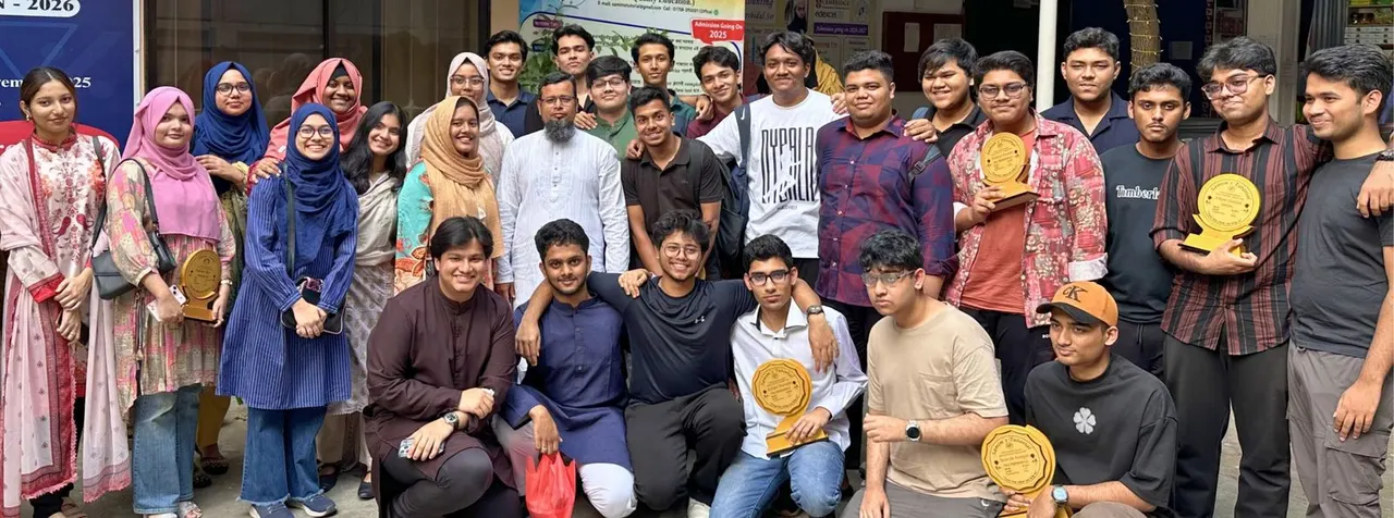 Samim Sir with a group of students holding their awards outside Samim's Tutorial